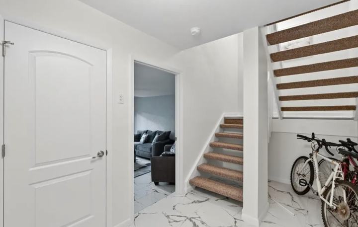 Entry level of the Marco Island monthly rental with staircase and bike storage