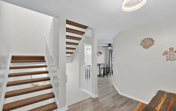Coastal staircase connecting the three levels of the Marco Island townhouse rental