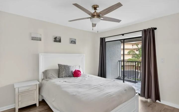 Guest bedroom with balcony access in the Marco Island snowbird rental