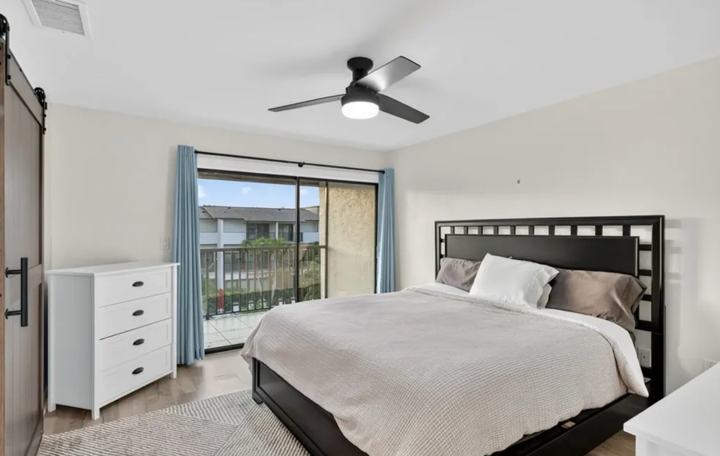 Primary bedroom with private balcony in the Marco Island long term rental