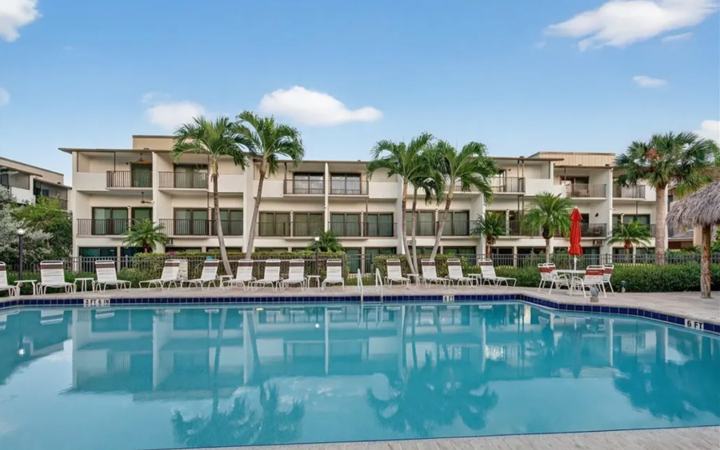 Community pool and courtyard beside the Marco Island monthly rental townhouse